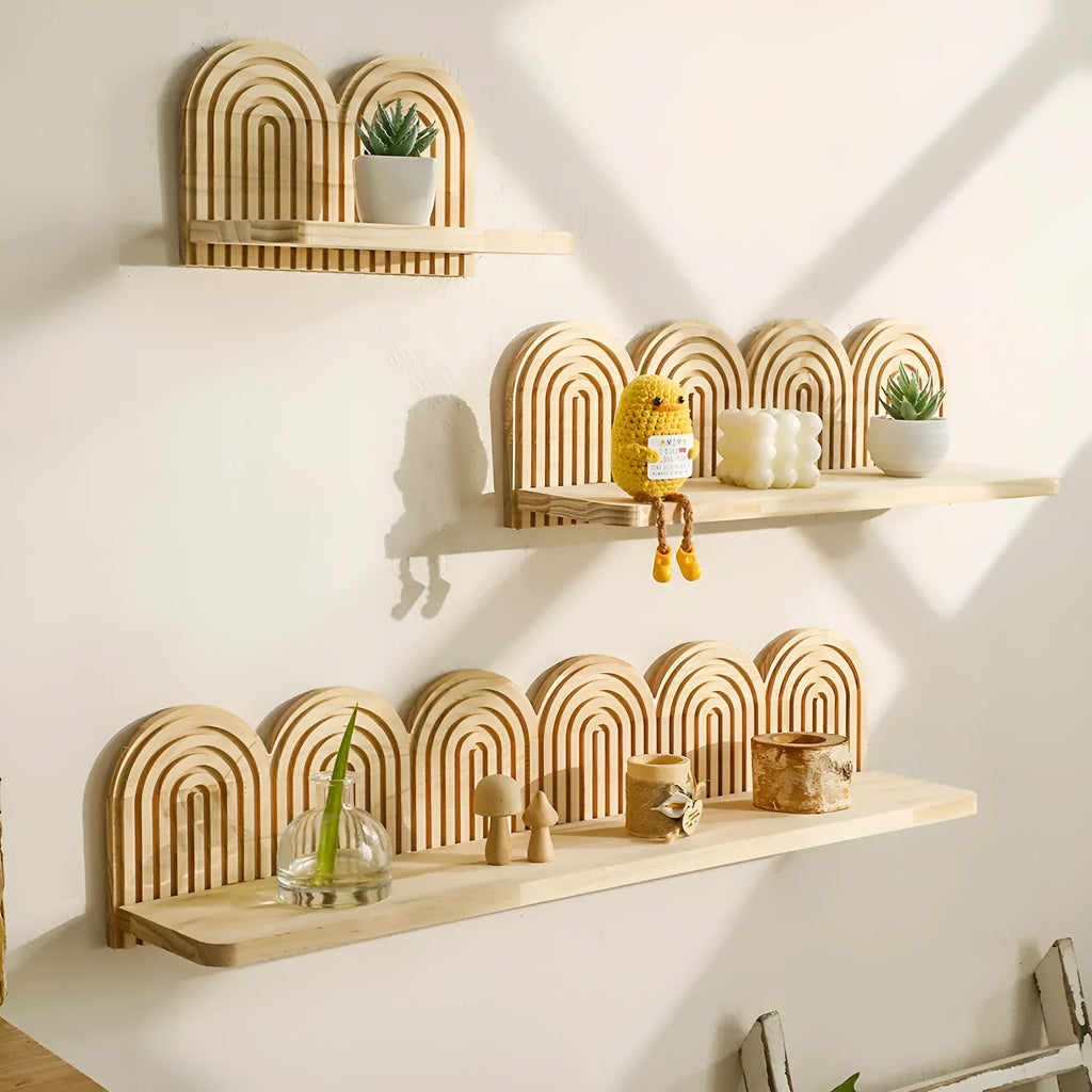 Solid wood multi-layer wall shelf holding several small potted plants.