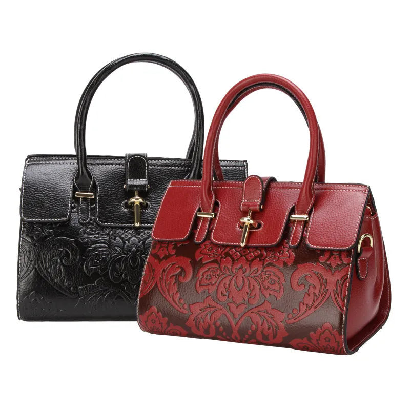 Women's oval vintage crossbody handbag in genuine leather with embossing details and internal organisers