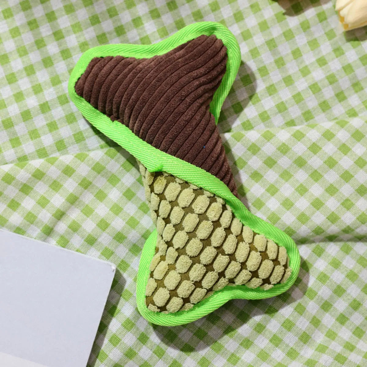 Blue teddy dog toy shaped like a bone with a corn fleece lining and integrated sound module