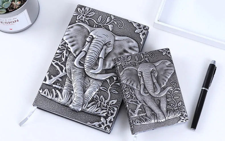 PU leather A5 notebook with three-dimensional embossed cover and bronze highlights, open to beige pages