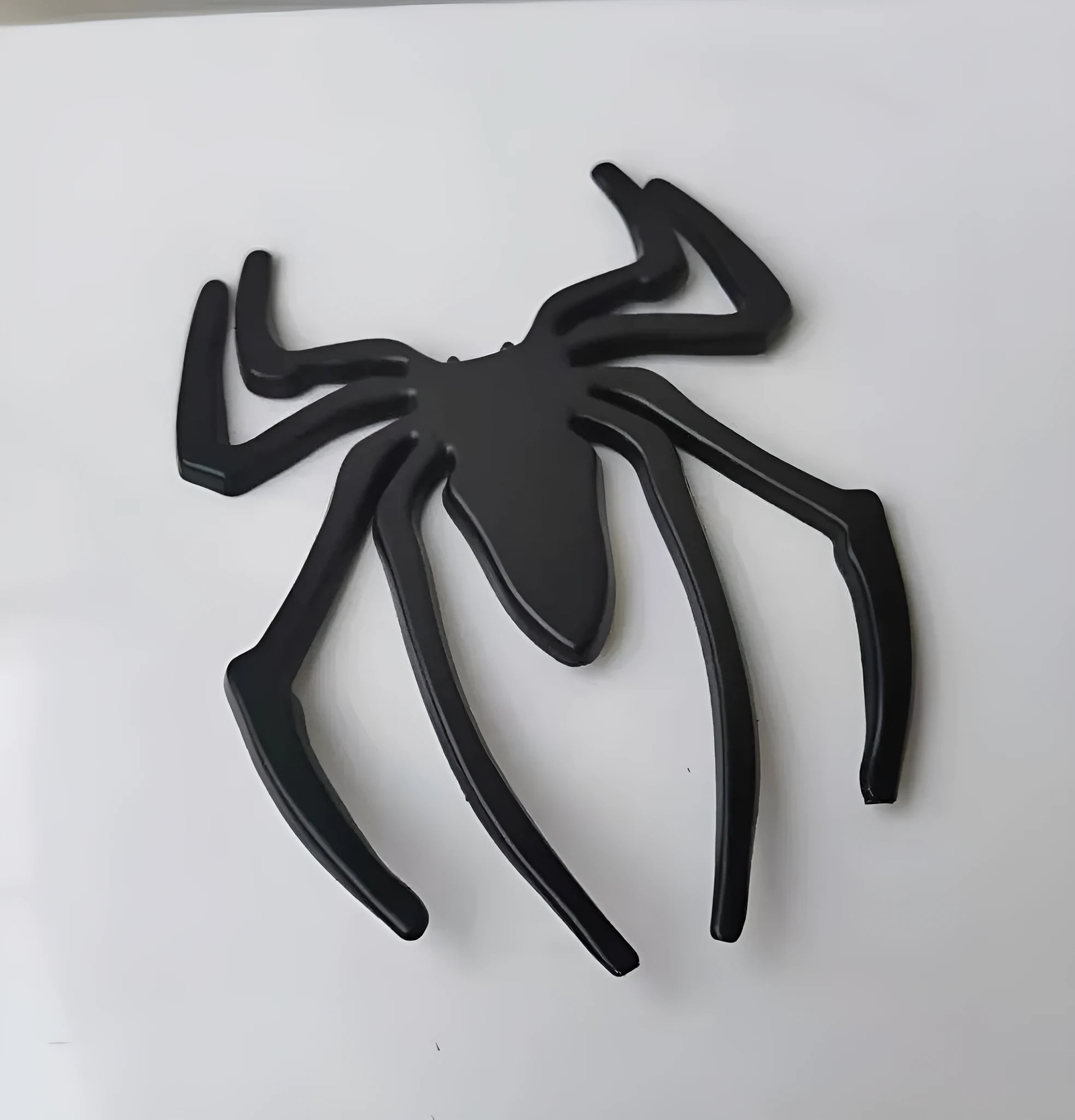 Three-dimensional zinc alloy spider bumper sticker in metallic colours