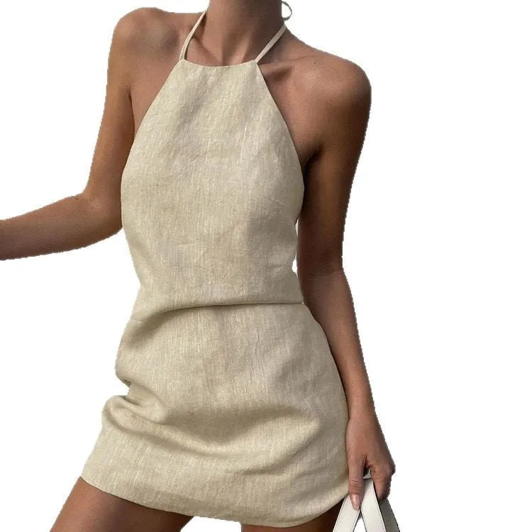 Women's solid colour linen A-line summer dress on hanger showing midi length and casual design