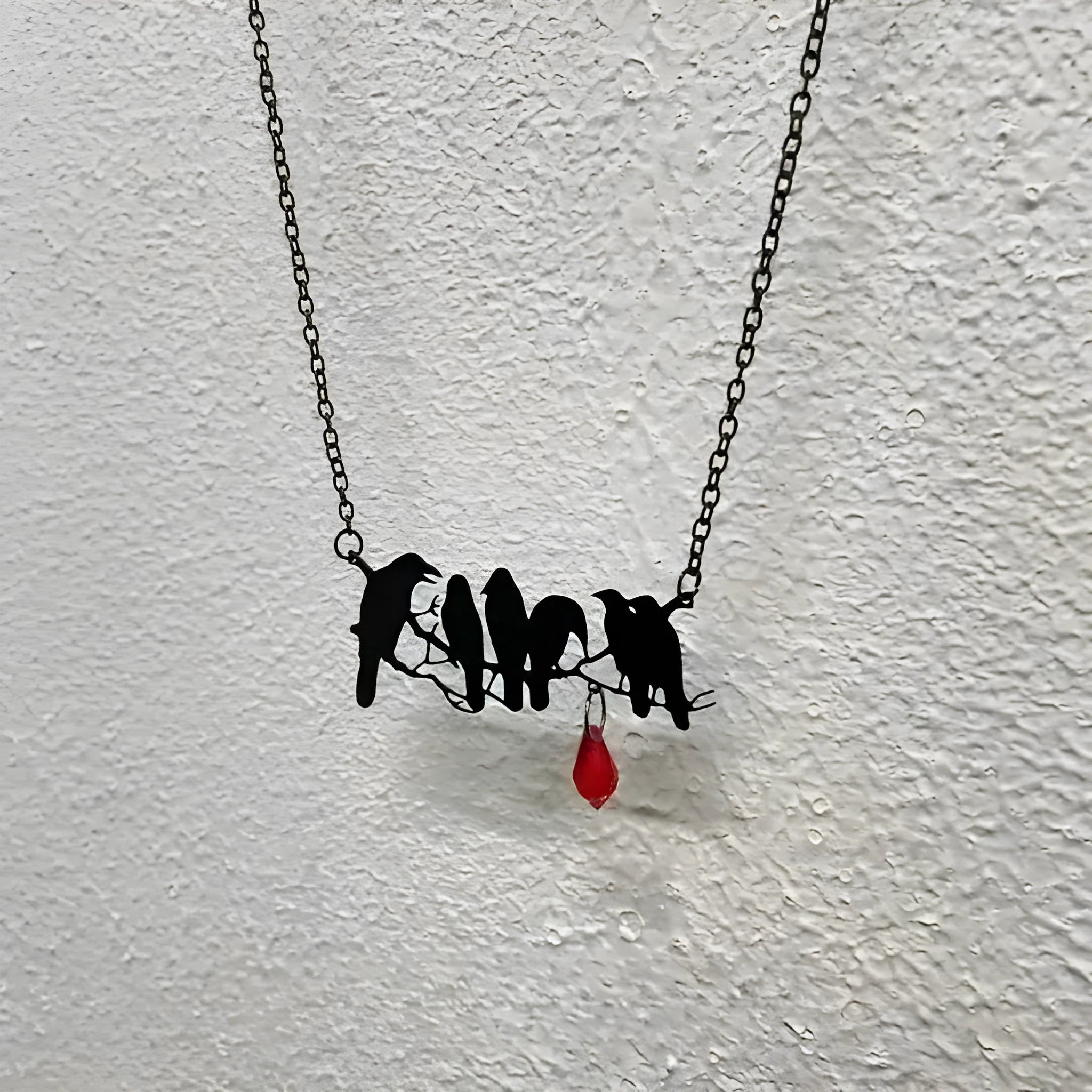 Black crow bird design necklace with electroplated finish on cross chain