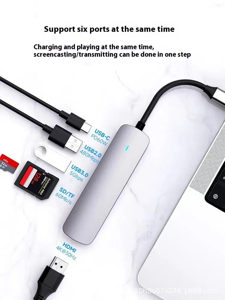 USB-C 7-in-1 expansion dock with HDMI port, multiple USB ports, and a 15cm black cable.