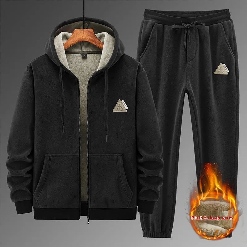 Men's grey hooded sports sweater and matching trousers laid flat.
