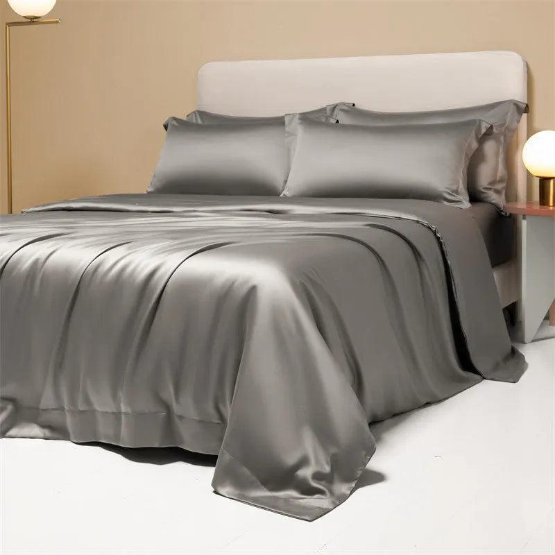 A modern, neatly made bed with a Lenzing Tencel duvet cover and pillowcases in a choice of nine colours like Sea Salt Blue.