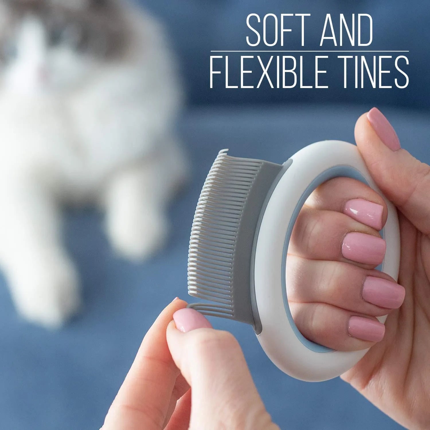 Blue pet deshedding comb with soft teeth and ergonomic handle for cats and dogs.
