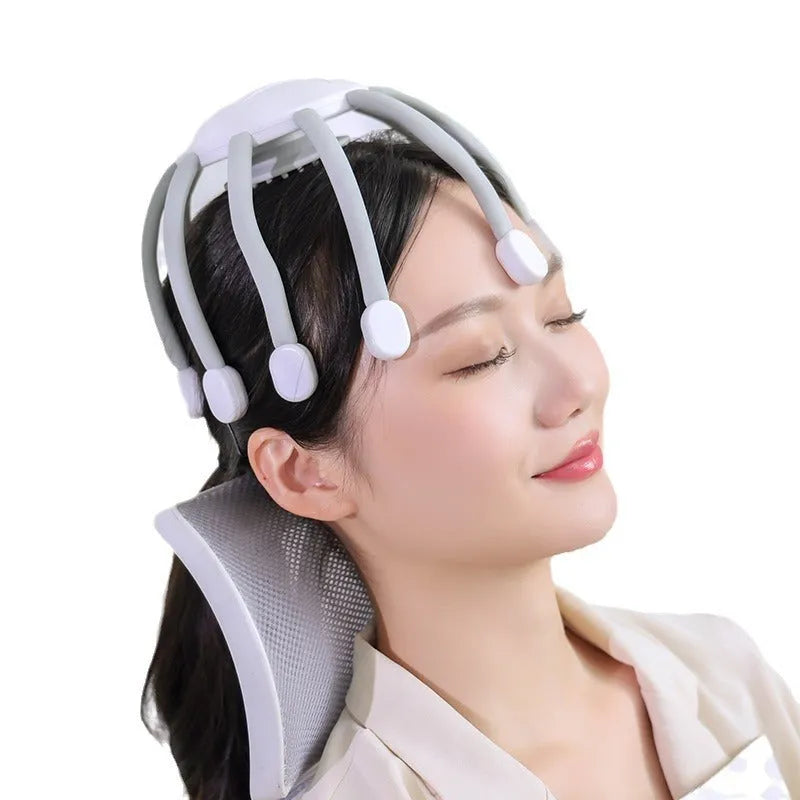 Black handheld head massager with eight extending claws showing silicone tips and control button