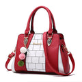 Contrasting colour handbag in PU leather with zipper closure, 29cm long, available in multiple colours