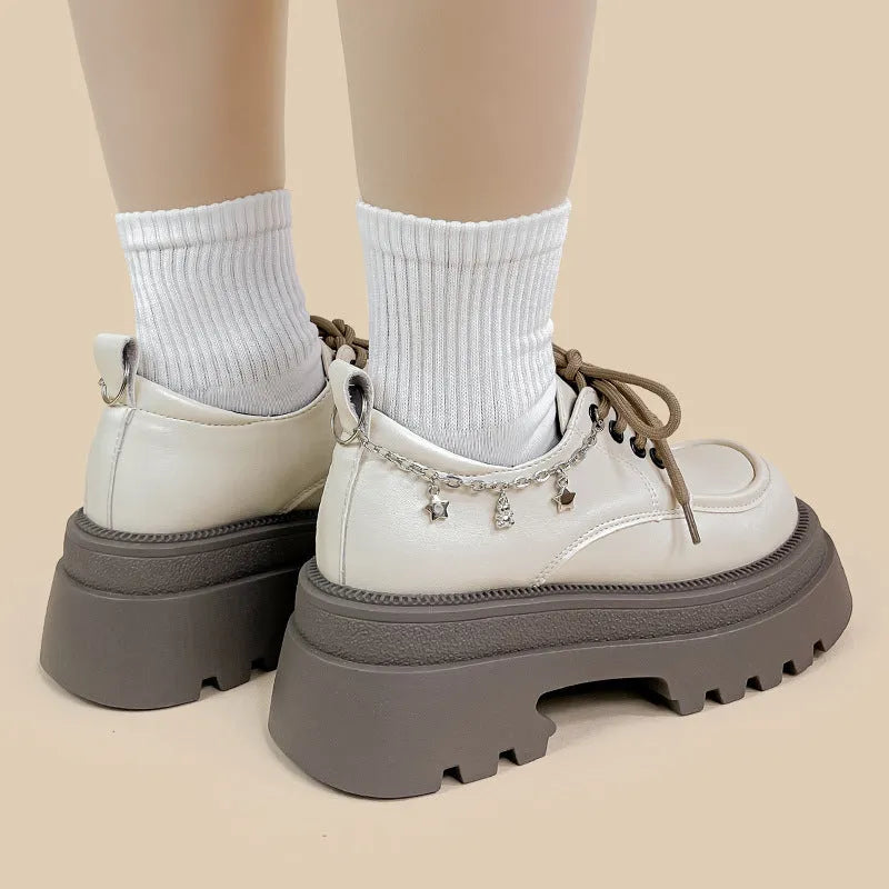 White women's platform Mary Jane shoes with chunky heel and XINGX bear design on round toe