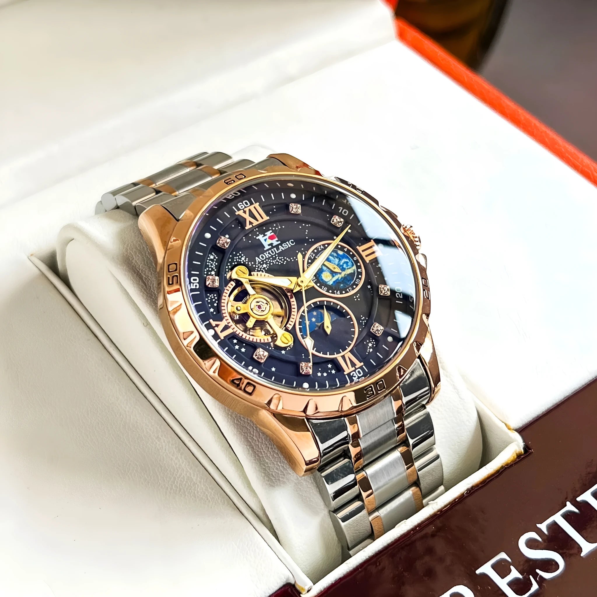 Men's automatic mechanical watch with large black dial and rose gold case.