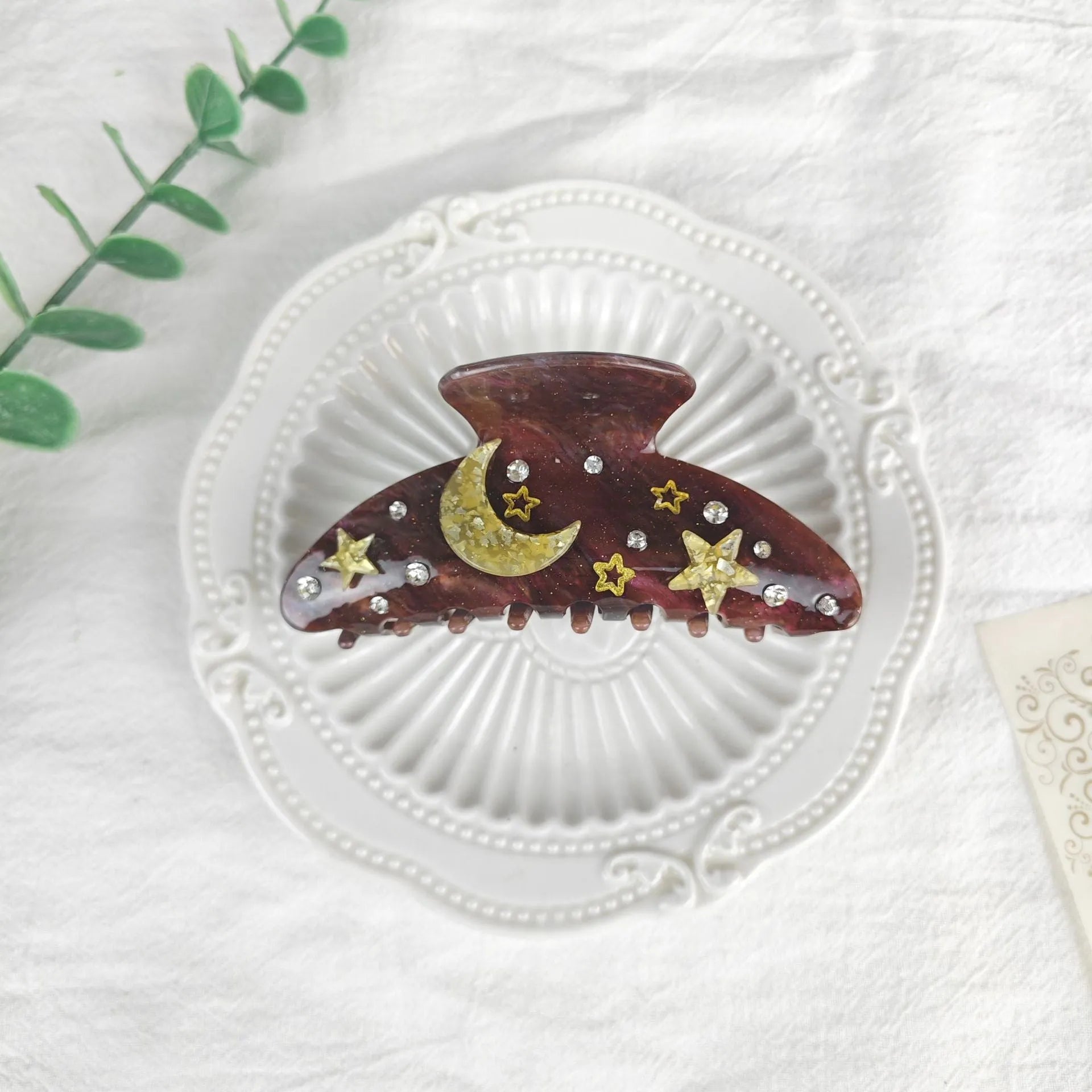 Oversized star moon barrettes with starry sky patterns in multiple colour options