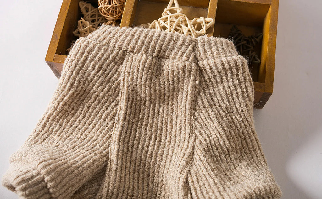 Brown cloth pullover sweater on a small dog, showing casual style and fit.