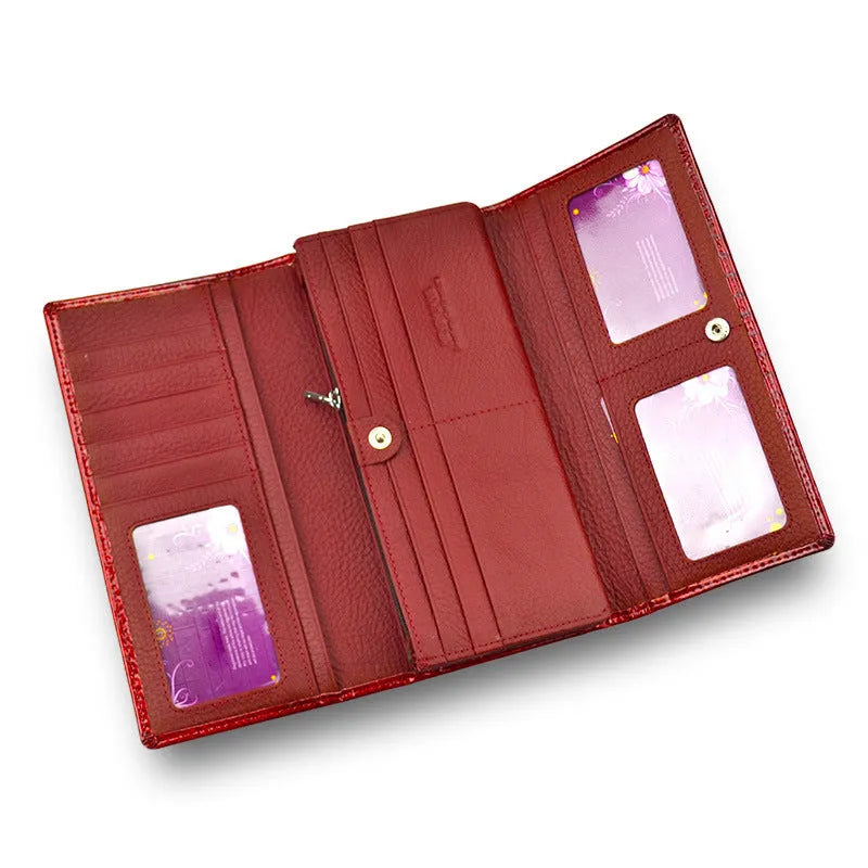 Women's red crocodile pattern patent leather coin purse with pigskin lining.