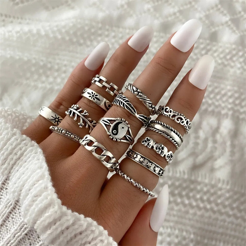 Alloy ring set with butterfly and snake retro geometric designs on display