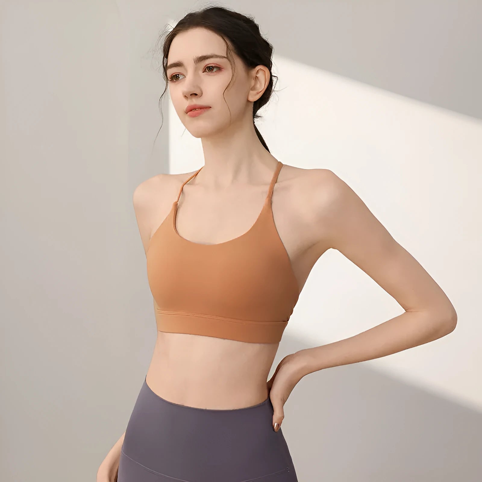 Women's nylon sports vest with fixed double shoulder straps in various colours for running and workout activities