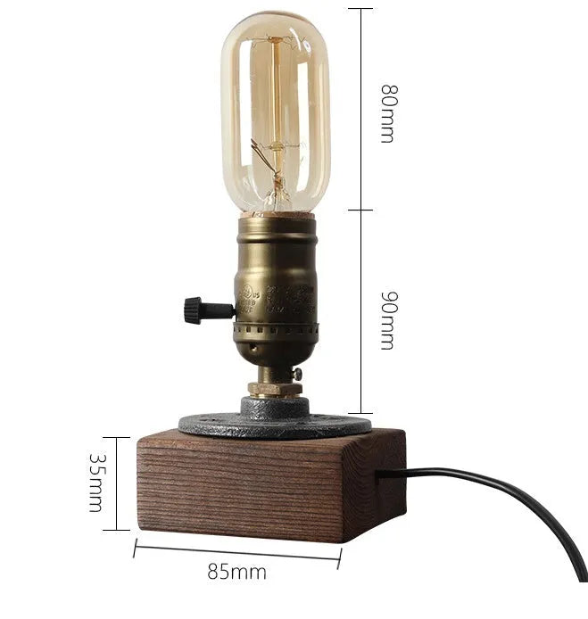 Wood and iron water pipe design table lamp on a surface