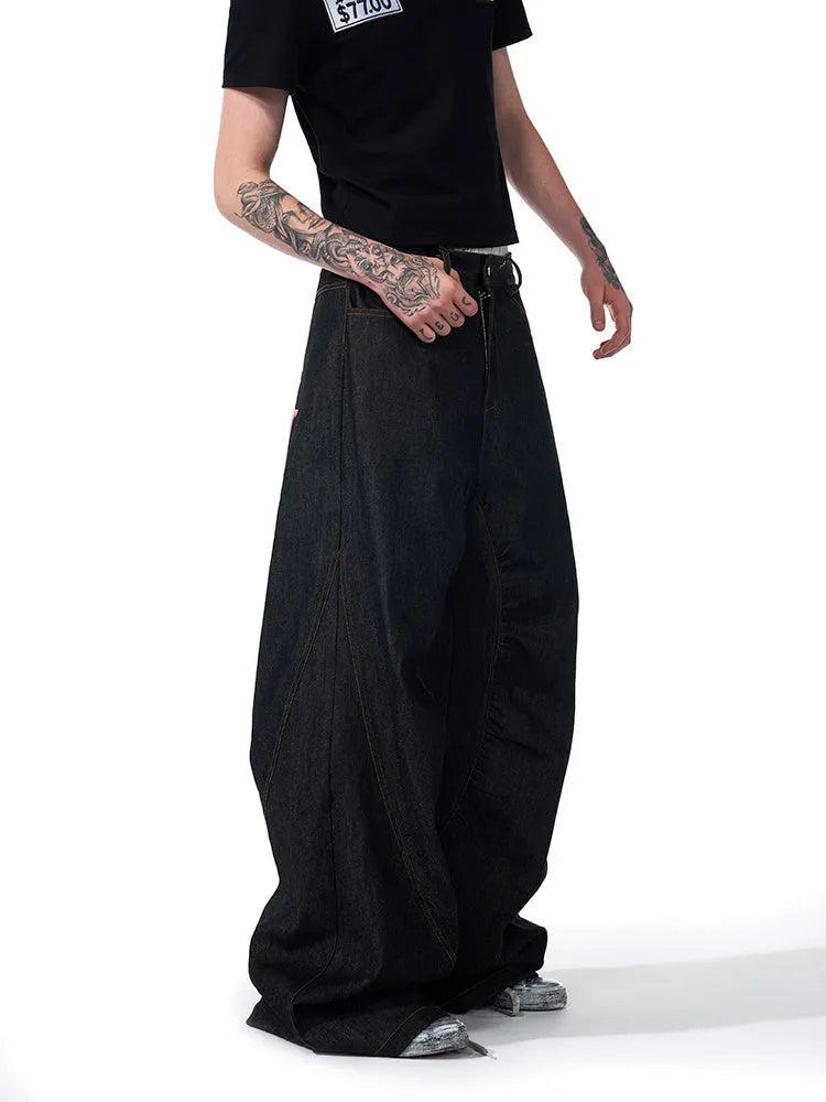 Black wide-leg straight jeans with temperature-sensitive colour-changing embroidery on the leg