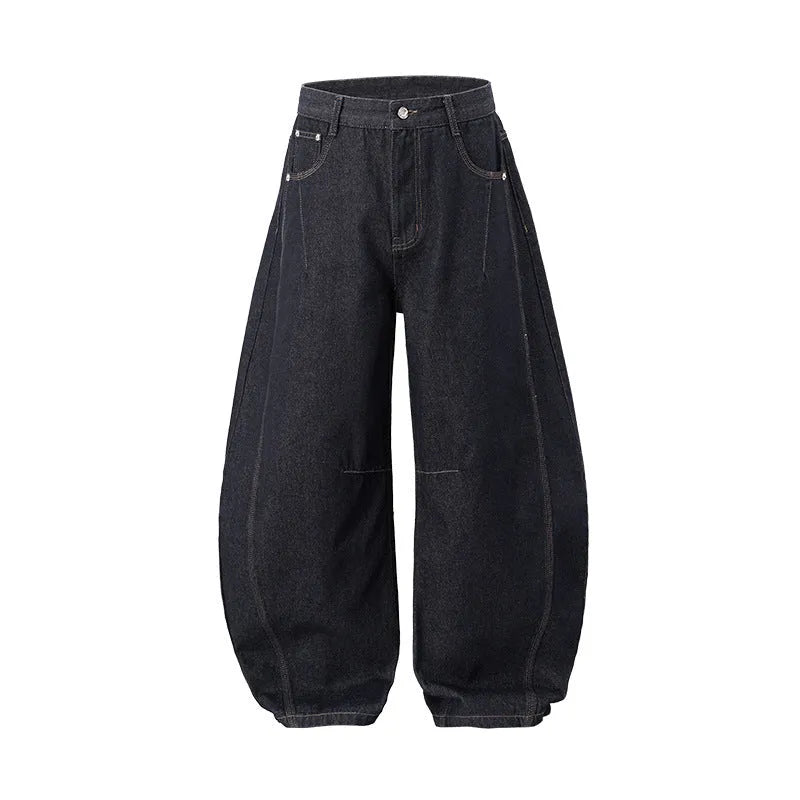 Men's original cow colour wide leg denim trousers laid flat.