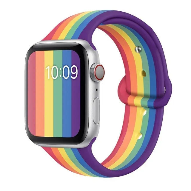 Silicone sports wristband with buckle in black, white, or rainbow colours showing two size options
