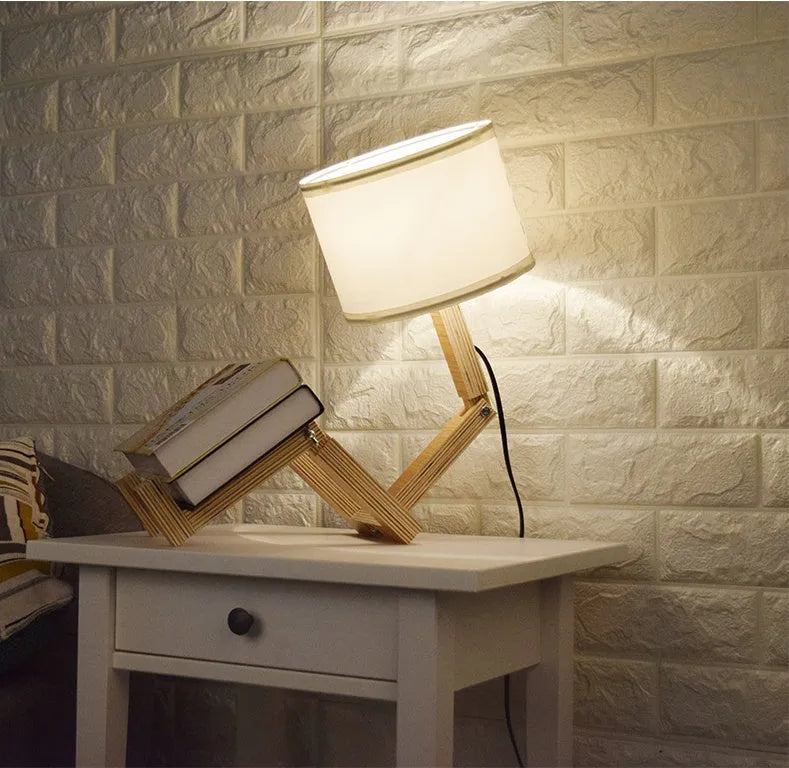 Creative humanoid wooden table lamp with white fabric shade measuring 22x44x16cm