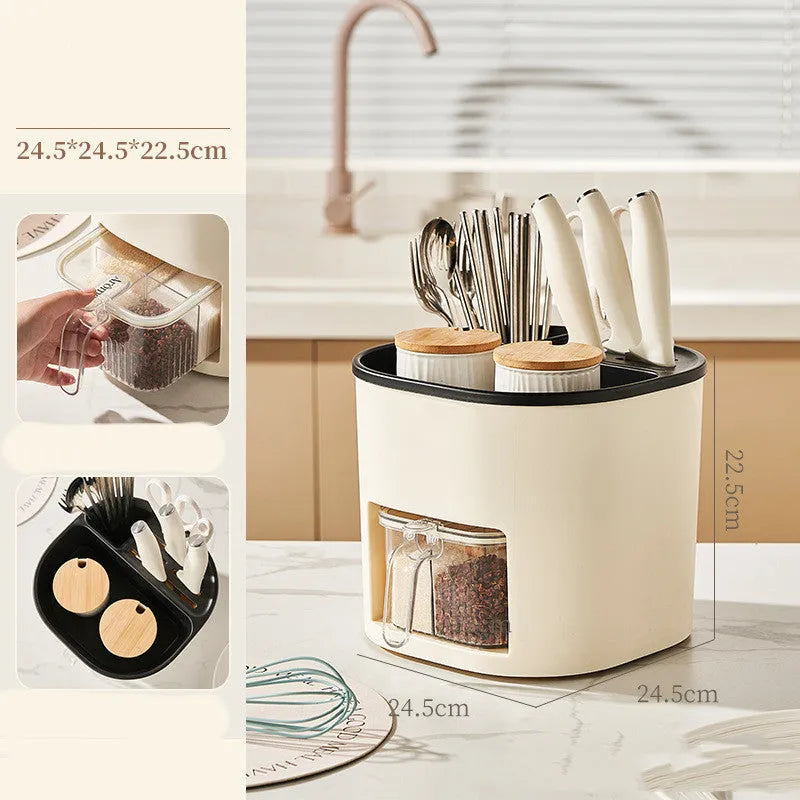 Plastic 360-degree rotating kitchen storage organiser with four compartments holding cutlery and a spice box