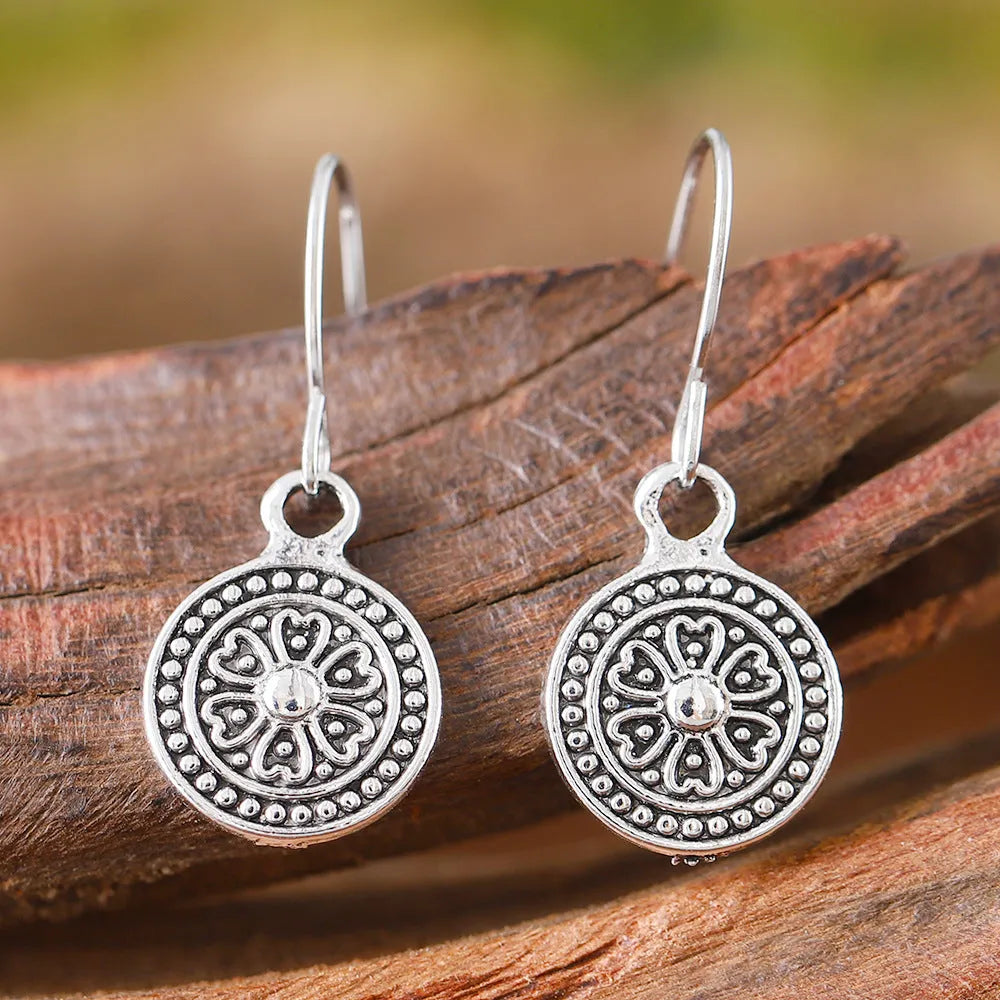 Retro geometric earrings with distressed ethnic prints in bohemian style