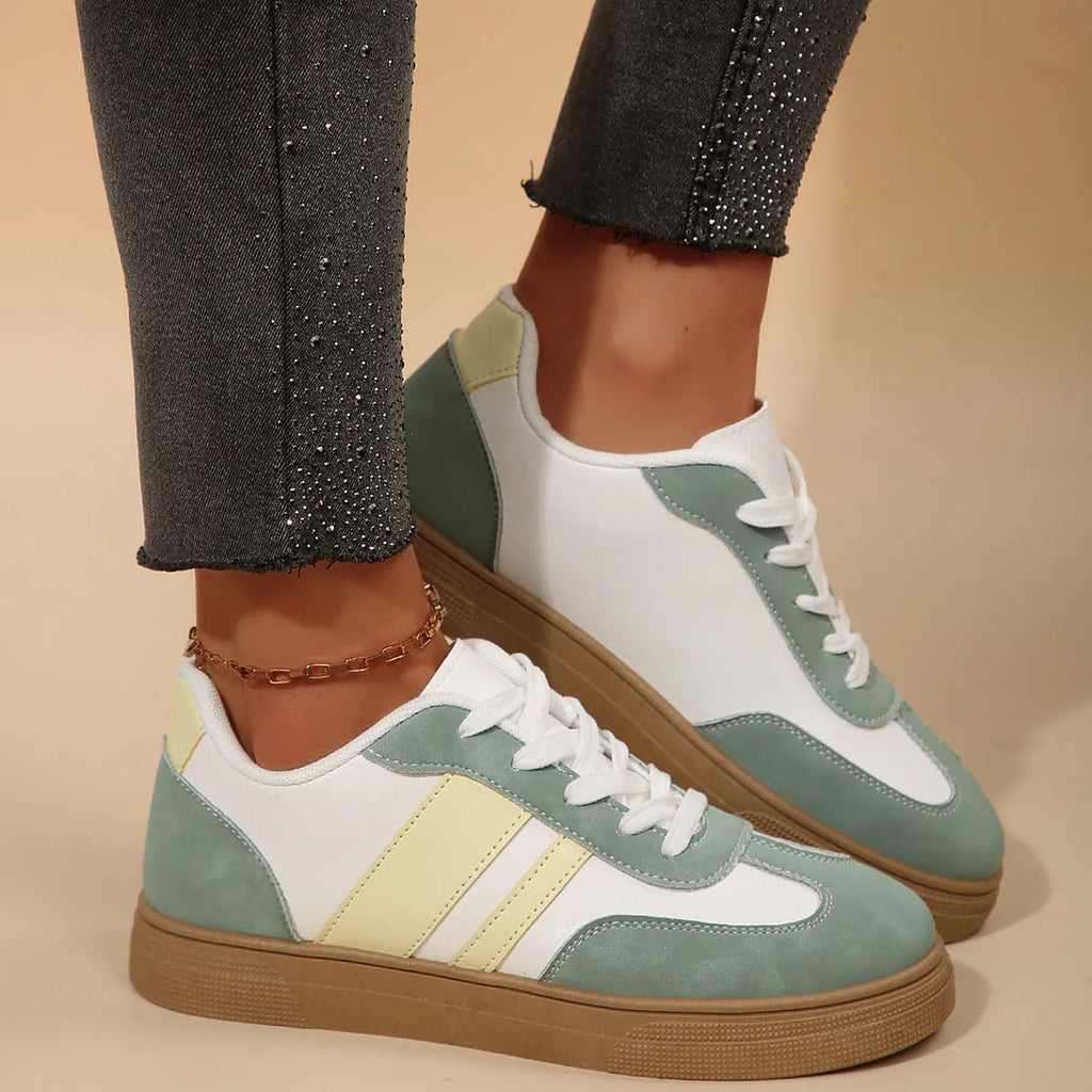 Women's green retro casual trainers with cross straps and round toe design on rubber sole