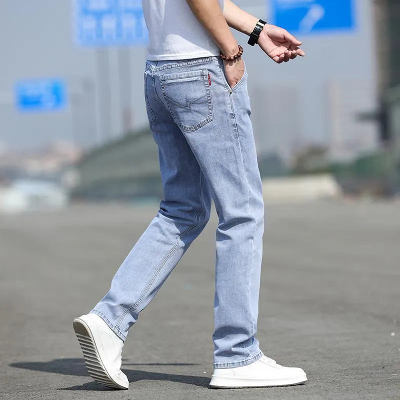 Men's smoky gray straight leg jeans with low waist and zipper fly, made from rabbit fur fabric.