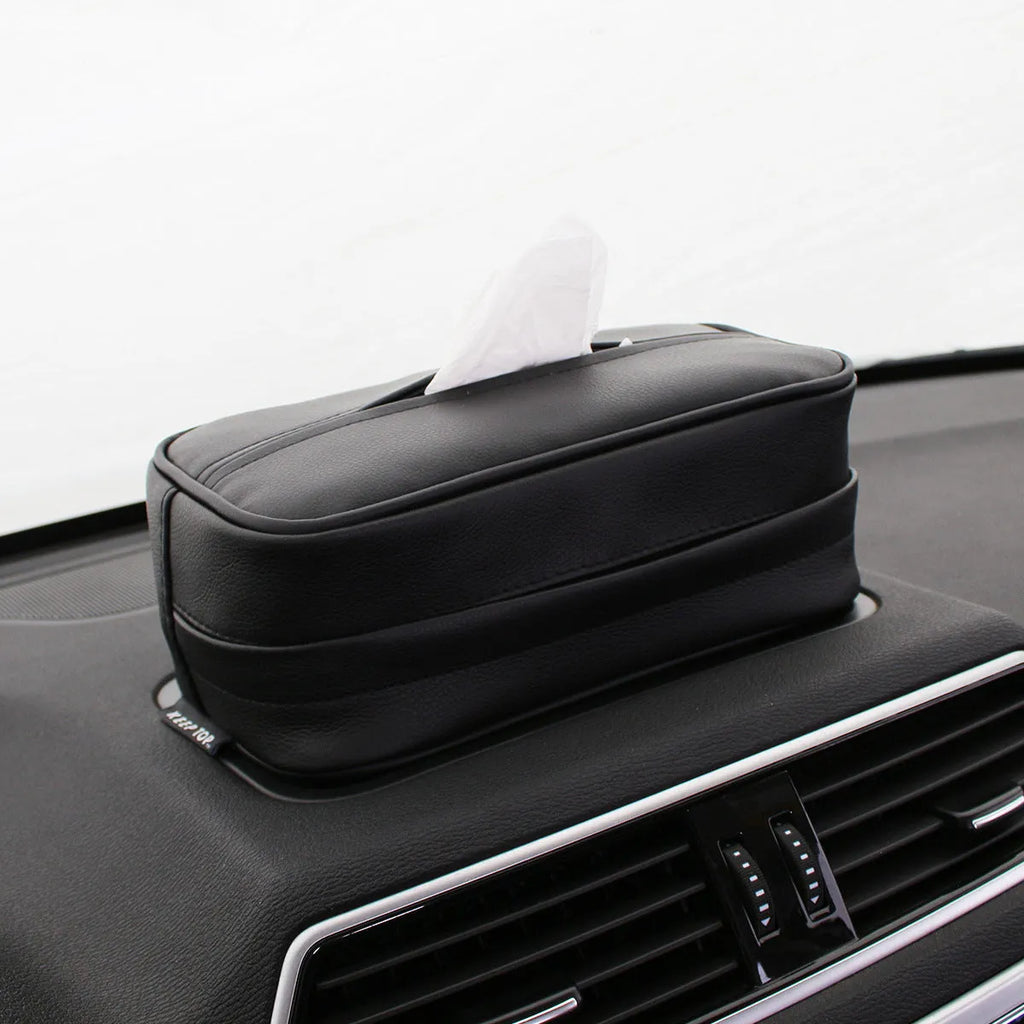 Black PU leather box with hanging loop on a car seat.