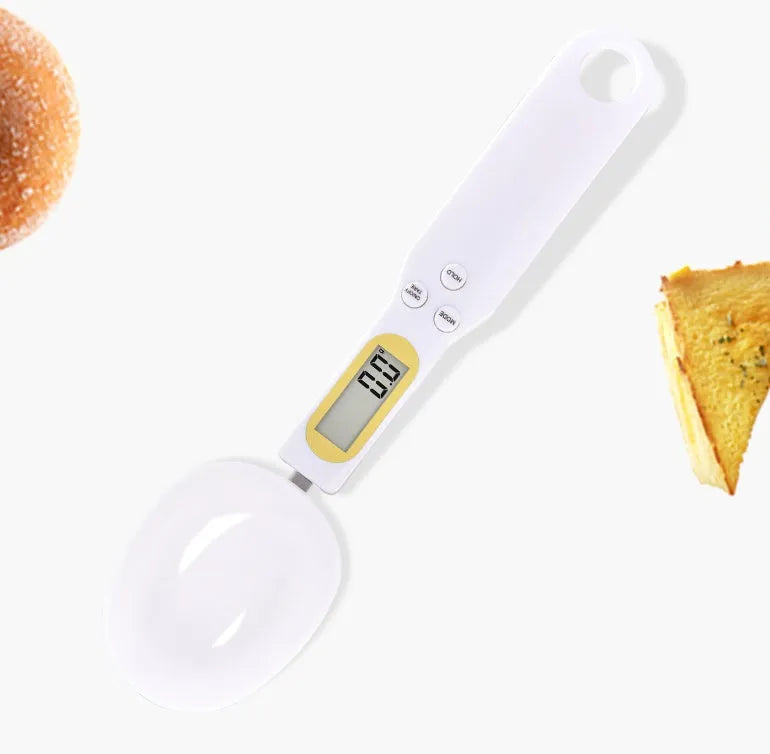 Black electronic measuring spoon scale with digital display showing weight measurement