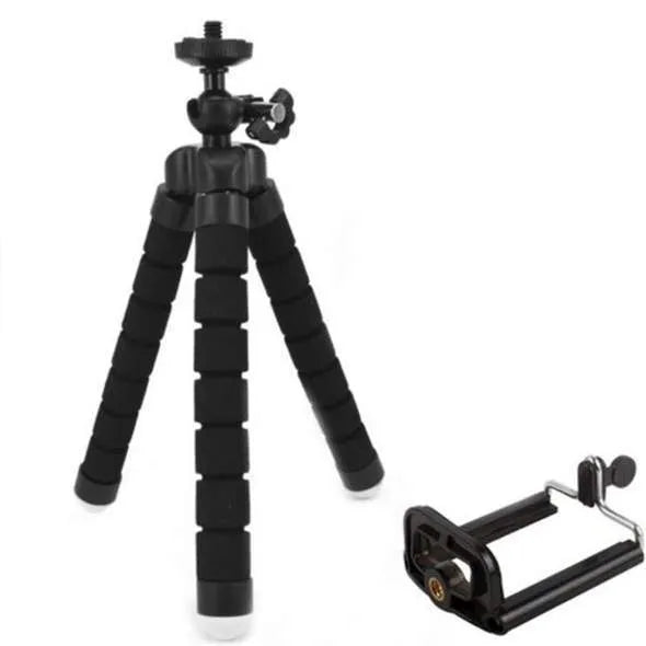 Black flexible octopus tripod with wrapped legs holding a smartphone next to a camera.