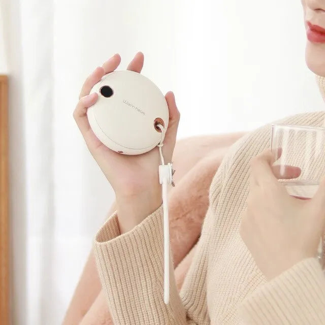 Green, pink or white portable power bank with digital display and integrated hand warmer function