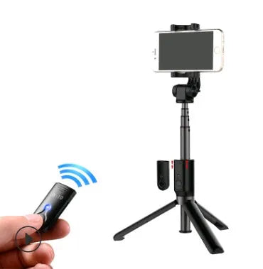 Black Bluetooth selfie stick with extended tripod legs holding a smartphone