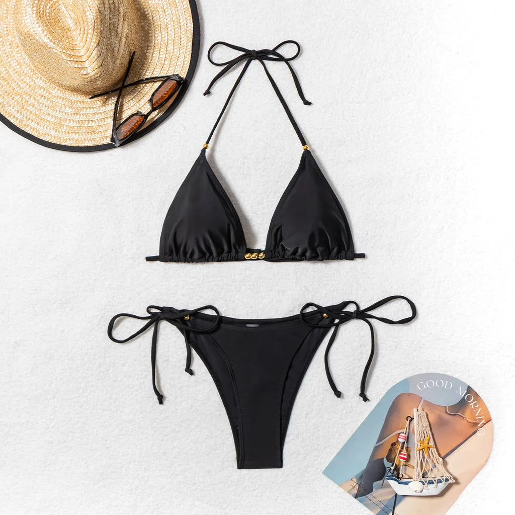 Black women's bikini swimsuit with silver metal bead detailing on the front.