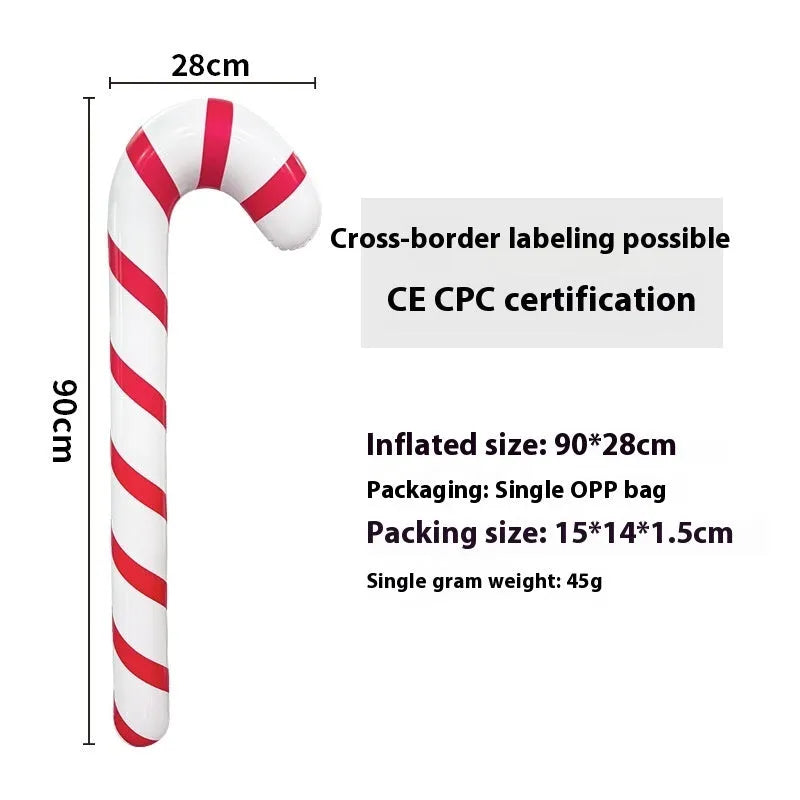 Large red and white inflatable Christmas ball with flashing lights standing in a garden.