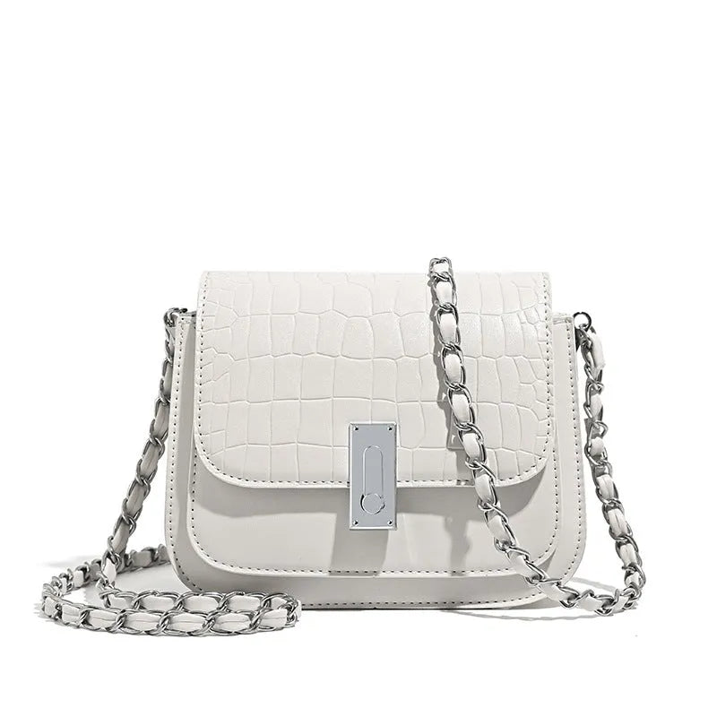 Soft PU leather women's crossbody shoulder bag in black, shown with a phone in the interior pocket.