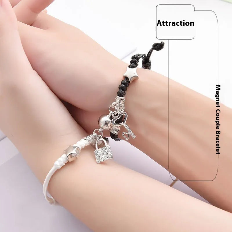 Magnetic couple bracelet pair in alloy with electroplated finish showing I love you design and crown style options