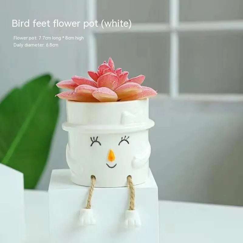 Ceramic hanging foot flowerpot in a cartoon style, shown as a desktop planter for succulent plants.