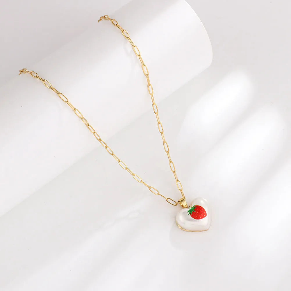 Adjustable necklace with heart charm and fruit pendant on 21-50cm chain