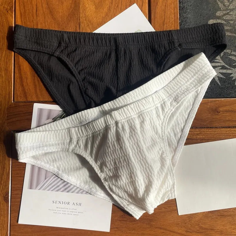 Men's cotton triangle underwear briefs in solid colours showing mid waist design.
