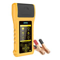 Autool BT760 vehicle battery tester with colour screen and attached test clips on a workbench.