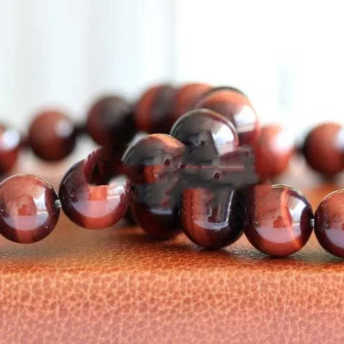 Red tigereye cat's eye beaded bracelet, grade 7A Lightning Eye Reserva, round geometric wood alexandrite beads