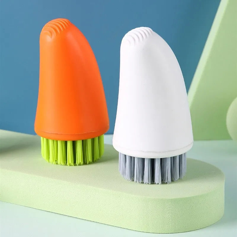 Carrot-shaped nylon cleaning brush in orange and white colours for kitchen vegetable washing