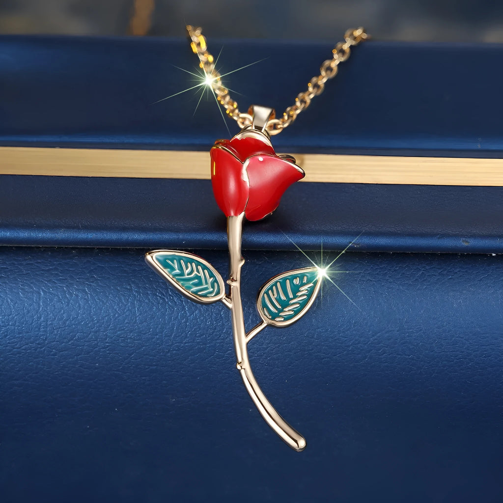 Champagne gold rose pendant necklace with copper drip oil finish and O-ring chain on display