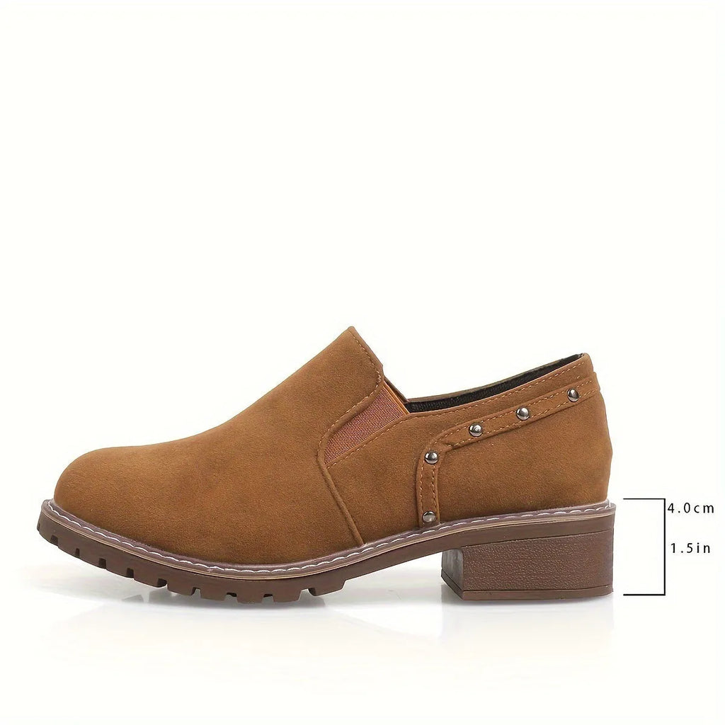 Women's light brown suede ankle boots with a low thick heel and elasticated ankle band.