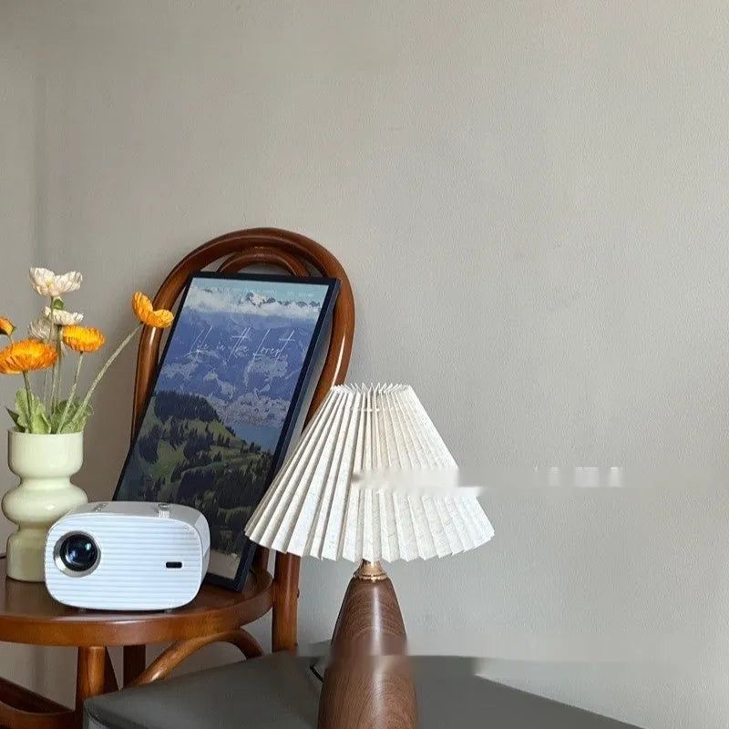 Nordic retro ceramic table lamp with pleated shade and remote control on bedside table
