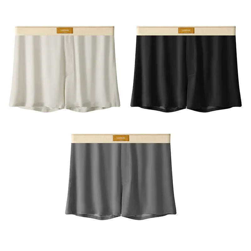 Pack of men's solid colour ice silk boxer shorts showing loose fit and mid-waist design.