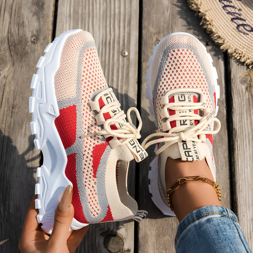 Women's Flyknit mesh lace-up sneakers in various colours with a round toe and rubber sole.