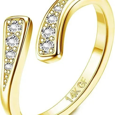 Gold plated alloy toe ring with rhinestone or water drop design on a toe.